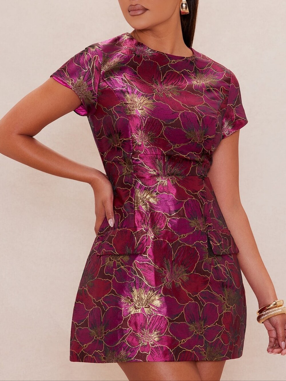 Short fitted mini dress made of luxurious jacquard fabric with a subtle metallic